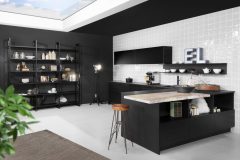 Black German kitchen with white wall tiles and bar stools