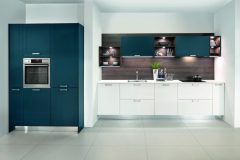 Modern dark blue and white German kitchen with wood highlights