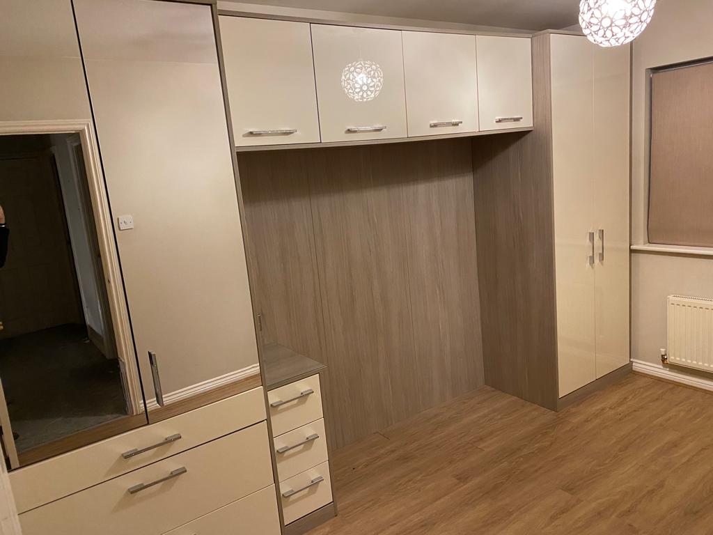 Fitted bedroom with over bed cabinets, wall decor cladding and Epro flooring fit
