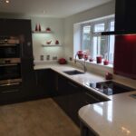 Ultra Gloss Kitchen with Quartz Worktops and Red Backsplash - Priorslee, Telford