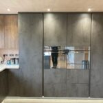 German Handle Less Dark Concreto Kitchen with Solid Quartz - Admaston